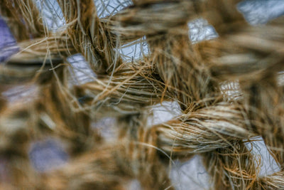 Hemp Carbon Supercapacitors: The Pore-Size Barrier to Grid Storage